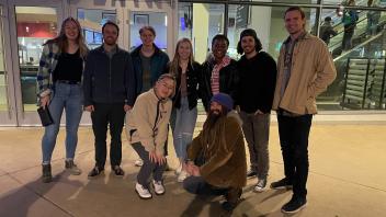 picture of laboratory group members at a Sacramento Kings basketball game