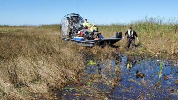 Airboat with field crew sampling wetlands in the Florida Everglades.