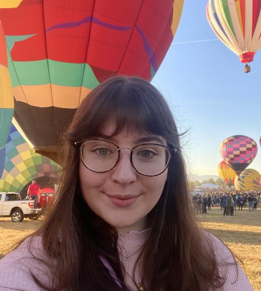 PhD Student Julia Davidson, hot air balloons in backdrop