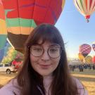 PhD Student Julia Davidson, hot air balloons in backdrop 